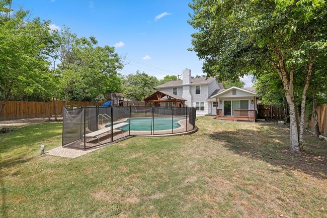 View of yard with a gazebo, a fenced in pool, and a fenced backyard | Image 31