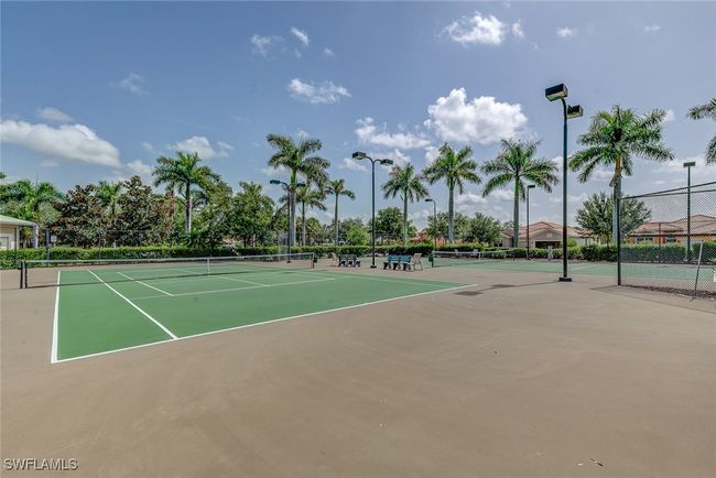 View of tennis court with community basketball court and fence | Image 41