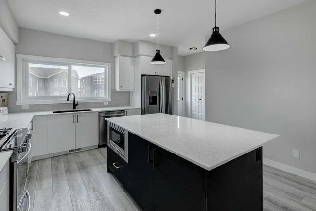 82 Edith Green Nw, Home with 4 bedrooms, 3 bathrooms and 2 parking in Calgary AB | Image 6