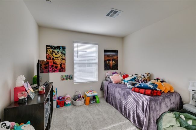 Carpeted bedroom with visible vents | Image 19