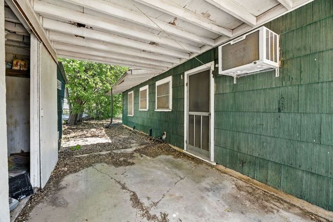 View of patio / terrace with a wall mounted air conditioner | Image 5