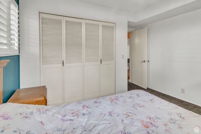 Carpeted bedroom featuring a closet | Image 24