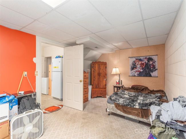 Finished space not counted in the total square footage as it is not contiguous to finished square footage, but could easily be so. Heat vent in this space. Temporary wall could be removed also | Image 20