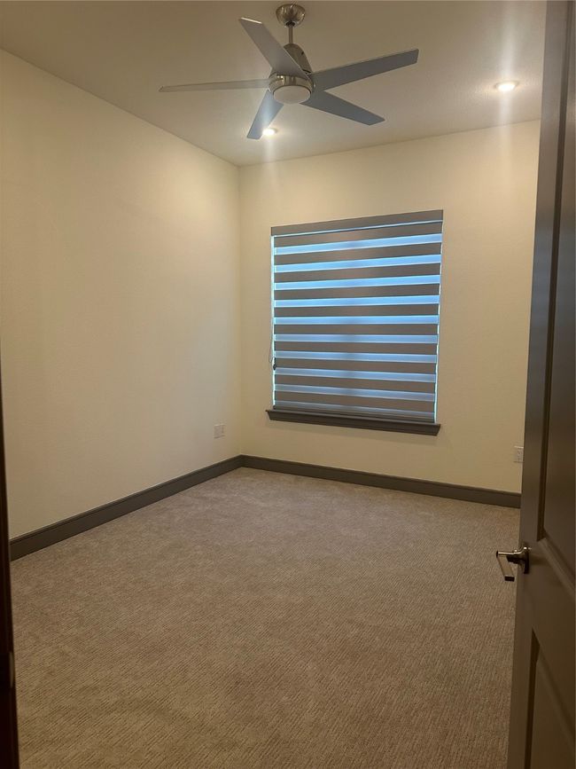 Unfurnished room featuring carpet and ceiling fan | Image 6