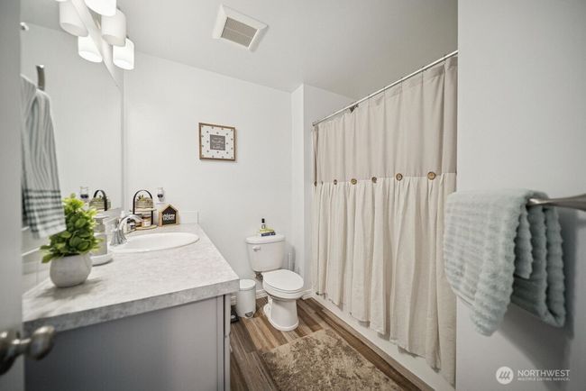 2nd bathroom with shower and tub. | Image 19