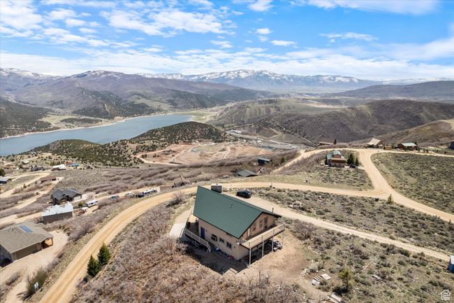 Drone / aerial view featuring a water and mountain view | Image 26