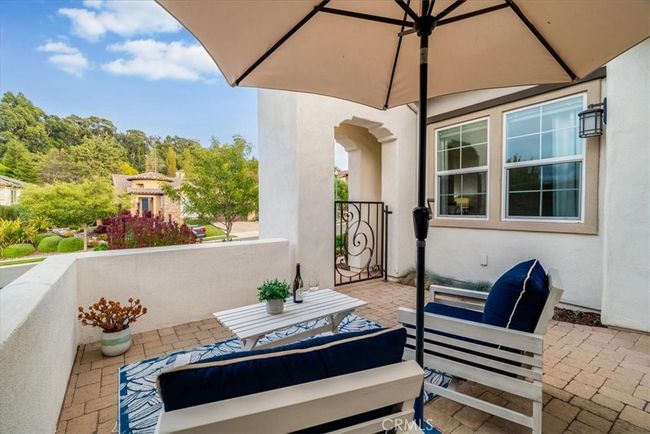 Gated entry area with fountain and sitting area. | Image 8