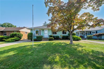 Single story home featuring a front lawn | Image 1