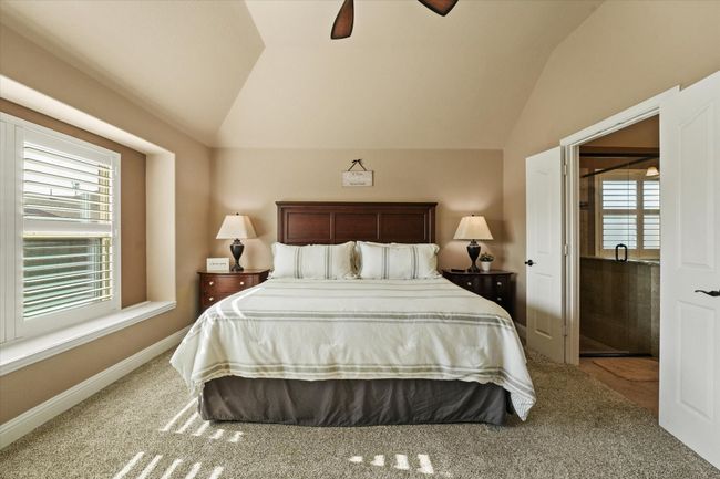 Bedroom with lofted ceiling, carpet floors, and ceiling fan | Image 22