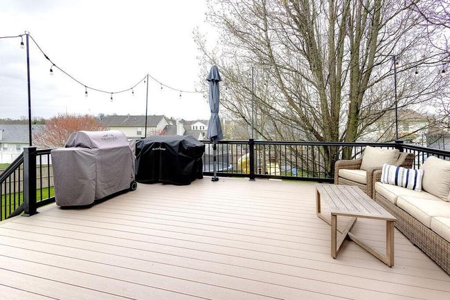 New composite deck overlooking back yard. | Image 43