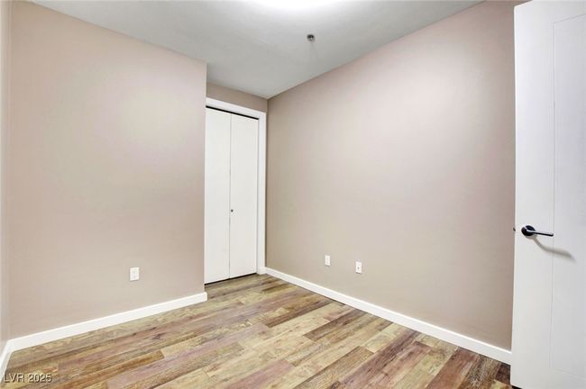 Second bedroom featuring baseboards and wood finished floors | Image 25