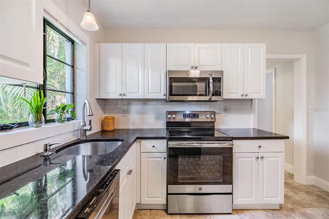 Raised panel wood cabinetry | Image 9