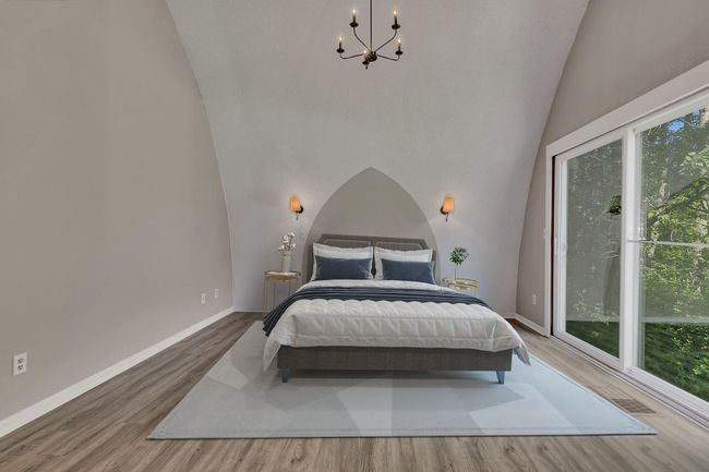 Grand cathedral ceiling making the primary feel like a true retreat-virtually staged | Image 15