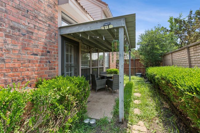 View of yard featuring a patio area and fence | Image 23