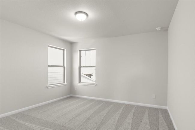 Empty room featuring baseboards and light colored carpet | Image 26