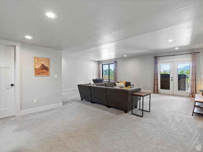 Living area featuring light carpet, recessed lighting, baseboards, and french doors | Image 44