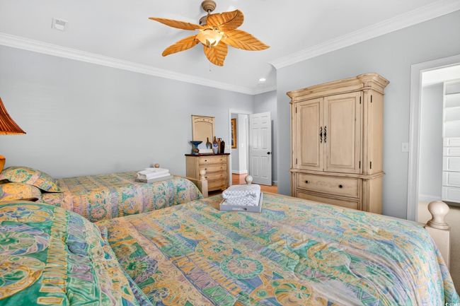 Bedroom with ornamental molding and a ceiling fan | Image 20
