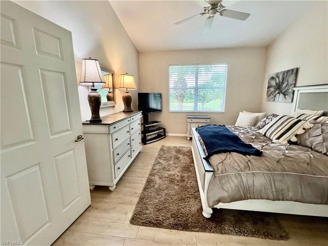 Inviting primary bedroom before furniture removed | Image 21