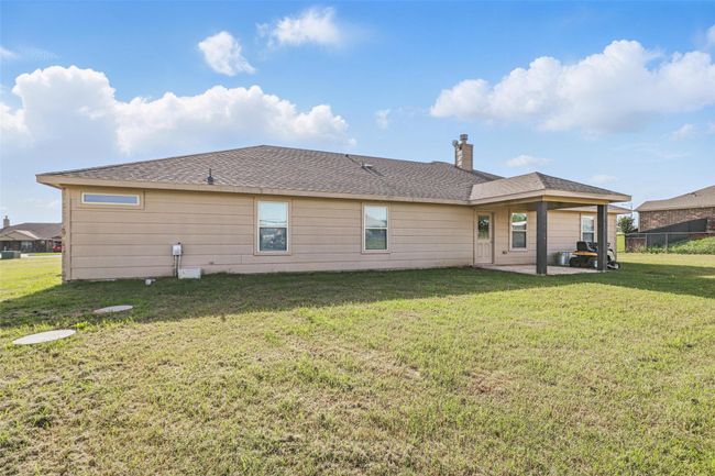 Rear view of property featuring a patio and a chimney | Image 26