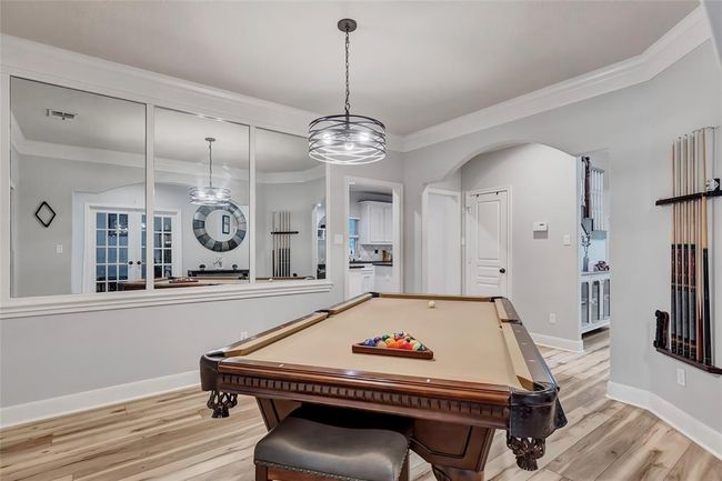 Formal Dining area, currently beings used for a pool table room | Image 11