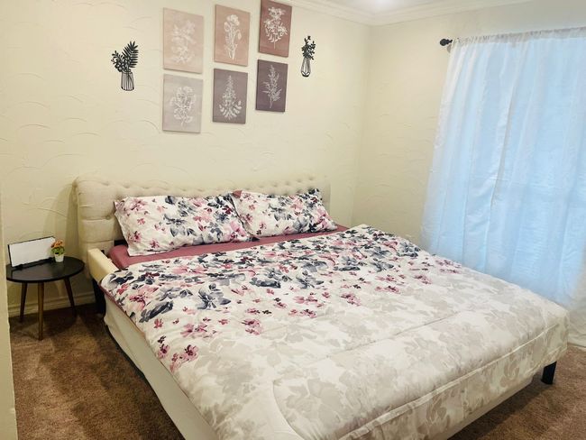 Carpeted bedroom with crown molding | Image 18