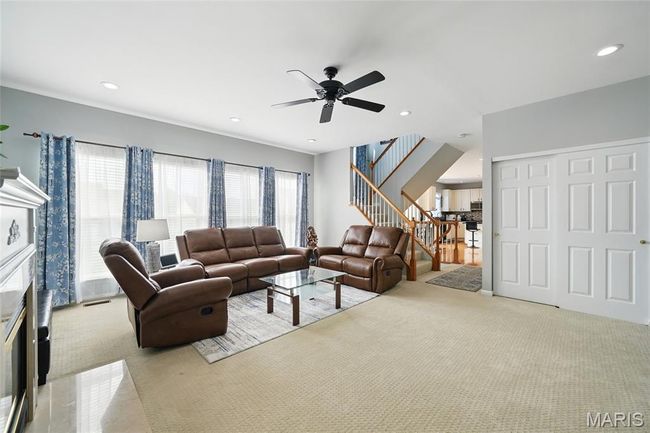 view from family area with stairs, ceiling fan, recessed lighting, and carpet | Image 9