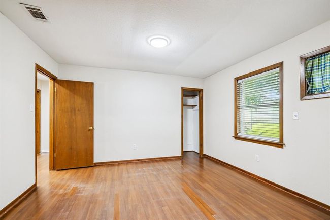 Bedroom #3 or Formal Dining Room vinyl flooring, fresh paint throughout, updated light fixture and 2" blinds. | Image 9