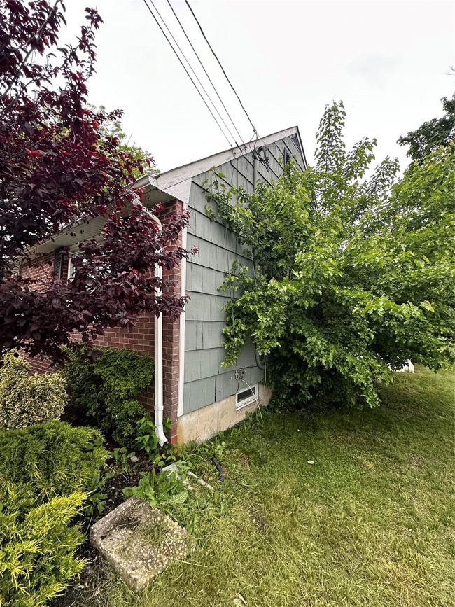 View of side of home with a lawn | Image 9