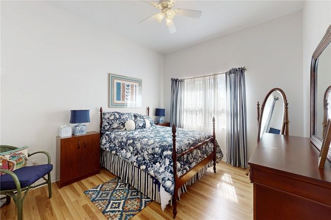 Bedroom featuring light wood-type flooring and ceiling fan | Image 20