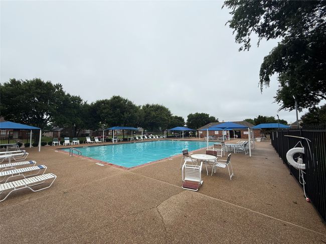 Community pool featuring a patio area and a gazebo | Image 34