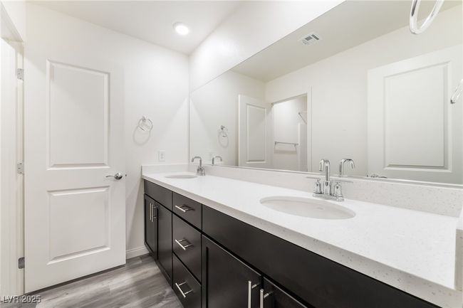 Bathroom with double vanity, wood finished floors, and recessed lighting | Image 30