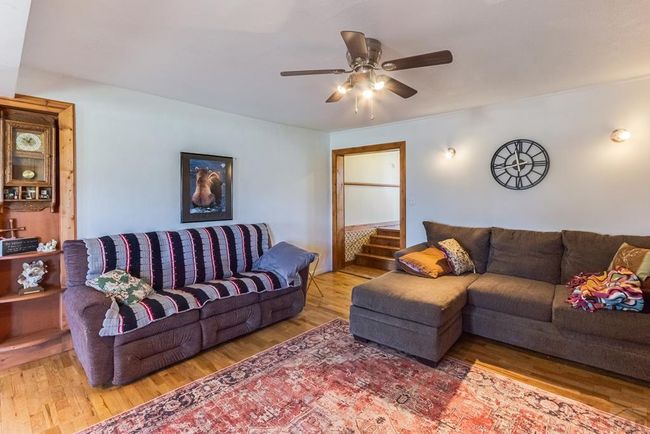 Living room with steps up to dining room | Image 15