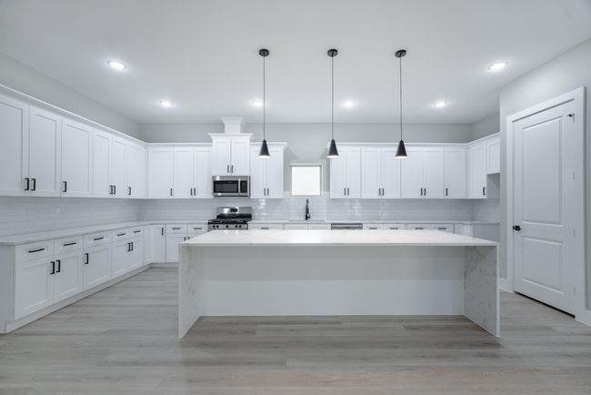 Kitchen opens to family room—perfect for entertaining and daily living | Image 17