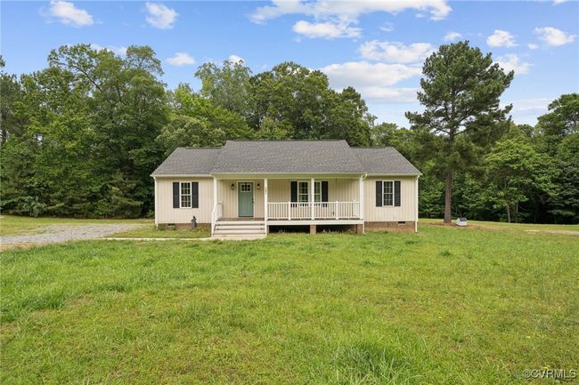 View of front of house featuring crawl space, a porch, and a front yard | Image 25