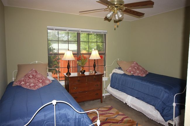 Bedroom featuring carpet floors and a ceiling fan | Image 18