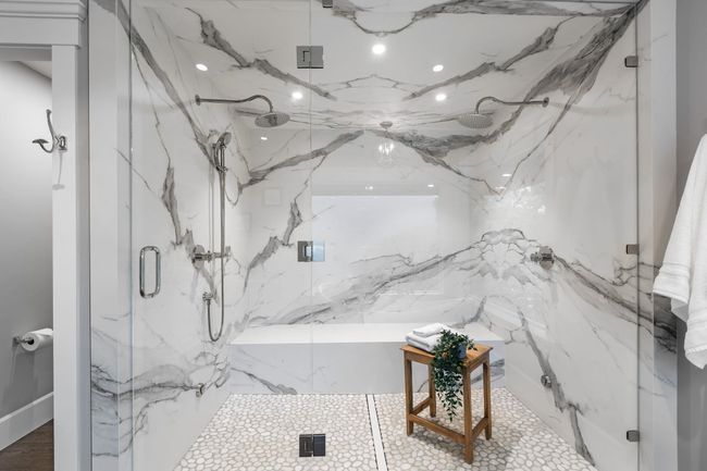 Bathroom featuring a marble finish shower | Image 24