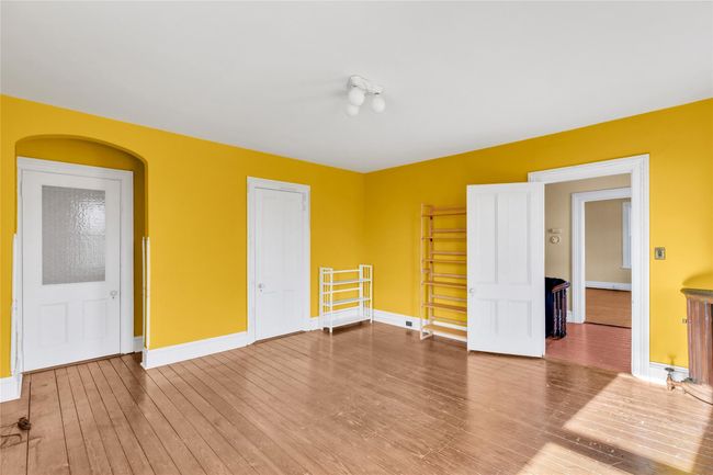 Spare room with wood finished floors and baseboards | Image 19