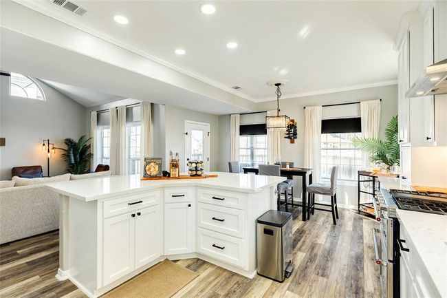 Island has quartz counter tops and extra storage options | Image 14
