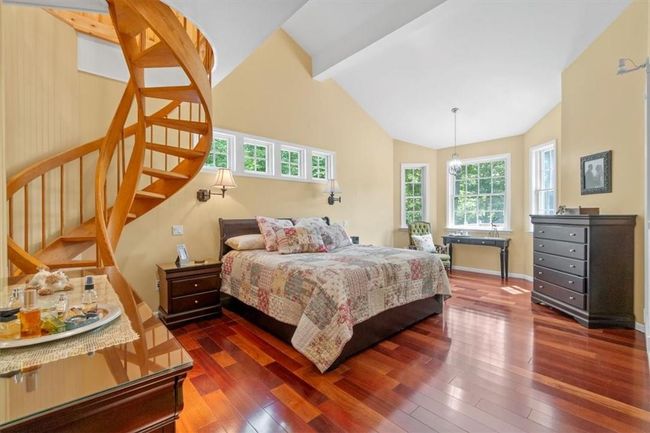 Red Oak double helix spiral staircase leading to a private office/den. | Image 21
