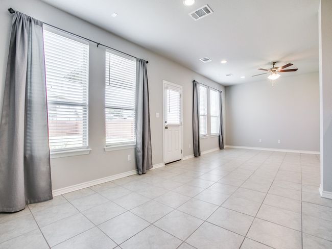 Spare room with ceiling fan, recessed lighting, light tile patterned floors, and baseboards | Image 8