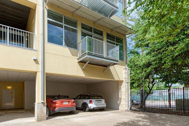 View of unit balcony from enclosed parking area | Image 30