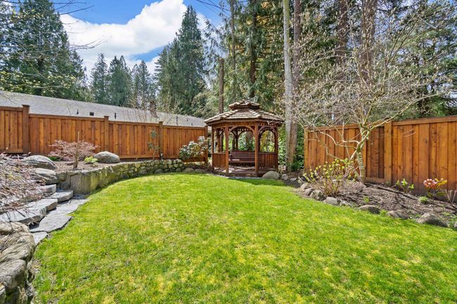 Fenced backyard with a gazebo | Image 34