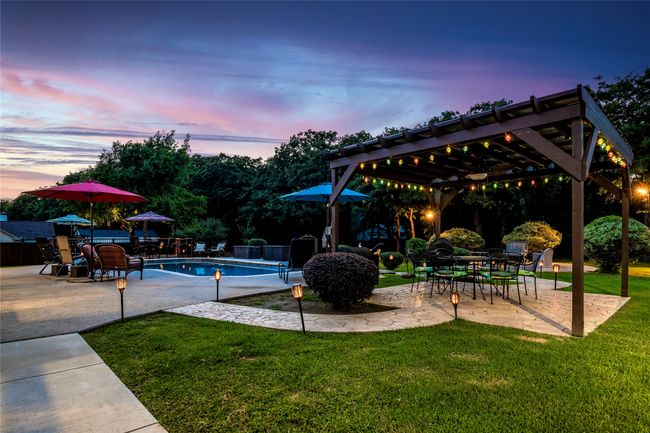 View of pool featuring a pergola and multiple sitting areas | Image 34