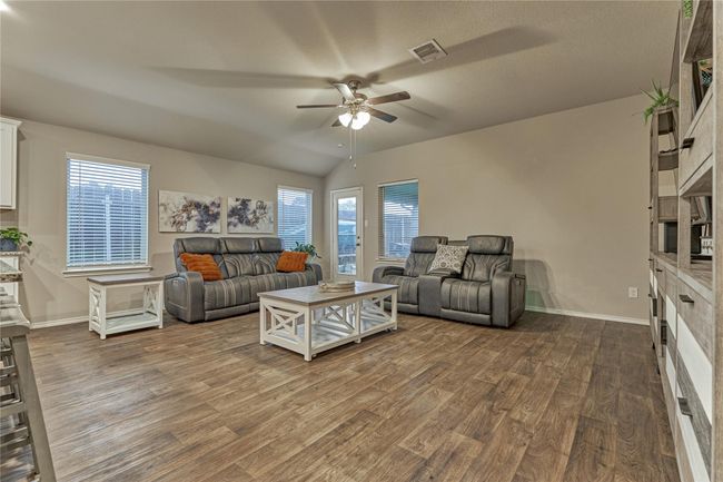 Enormous living room with natural light pouring through the windows. | Image 17