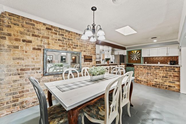 The brick accent wall adds lots of character and style to the home! | Image 10