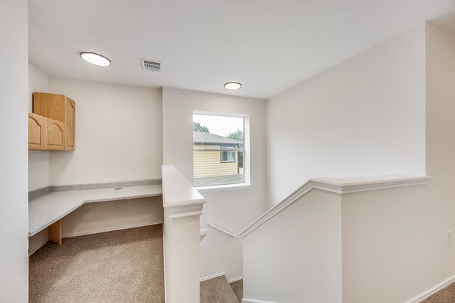 Stairway with carpet flooring and baseboards | Image 21