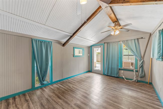 Spare room with ceiling fan and wood finished floors | Image 28