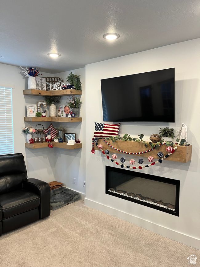 Carpeted living area with recessed lighting and baseboards | Image 4