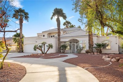 Front of home with circular driveway. | Image 2