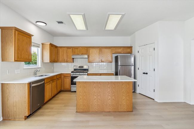 Full kitchen with central island | Image 4